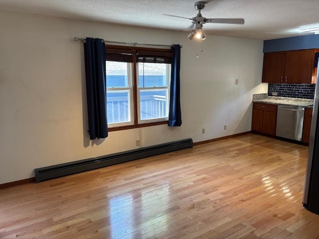 113 Chaffee Dr, Hiawatha, IA 52233 - kitchen featuring stainless steel dishwasher, a baseboard radiator, a ceiling fan, light wood-style floors, and a textured ceiling