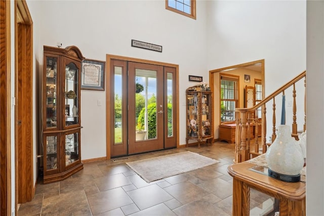 2545 F52 Trl, Parnell, IA 52325 - entryway with healthy amount of natural light, a towering ceiling, and baseboards