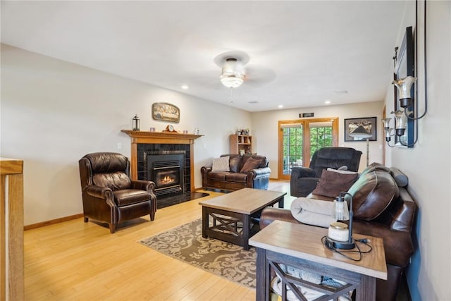2545 F52 Trl, Parnell, IA 52325 - living area featuring a ceiling fan, light wood-type flooring, a tile fireplace, recessed lighting, and baseboards