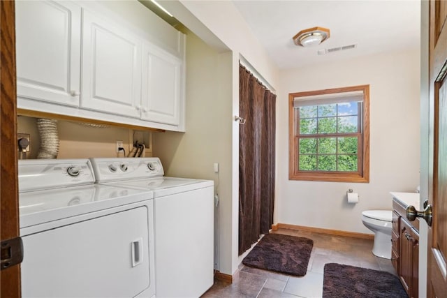 2545 F52 Trl, Parnell, IA 52325 - washroom with washing machine and dryer, baseboards, and light tile patterned floors
