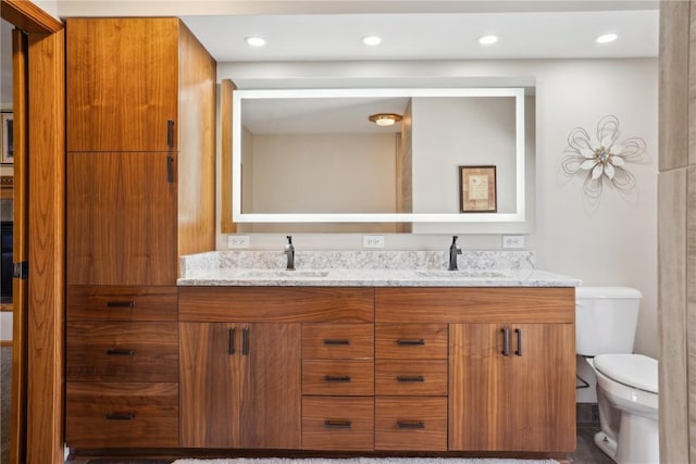 2545 F52 Trl, Parnell, IA 52325 - full bathroom featuring double vanity, toilet, and recessed lighting