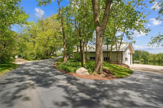2545 F52 Trl, Parnell, IA 52325 - view of front of property with asphalt driveway and a water view