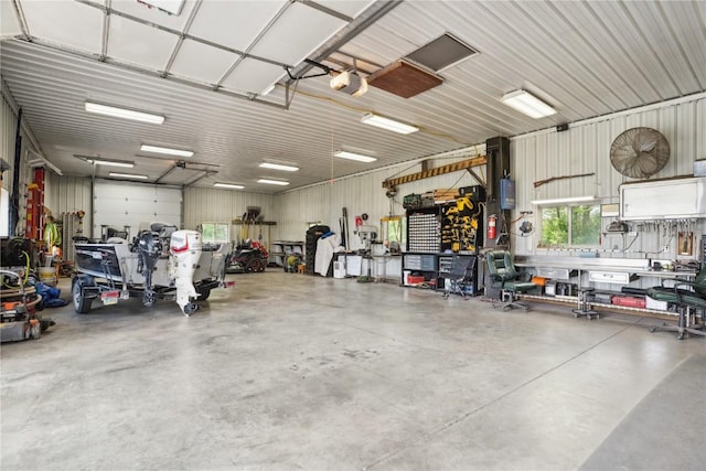 2545 F52 Trl, Parnell, IA 52325 - garage featuring a workshop area and a garage door opener