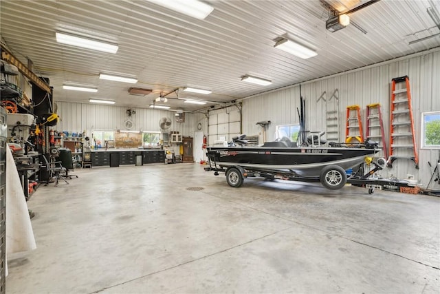 2545 F52 Trl, Parnell, IA 52325 - garage featuring a workshop area and a garage door opener