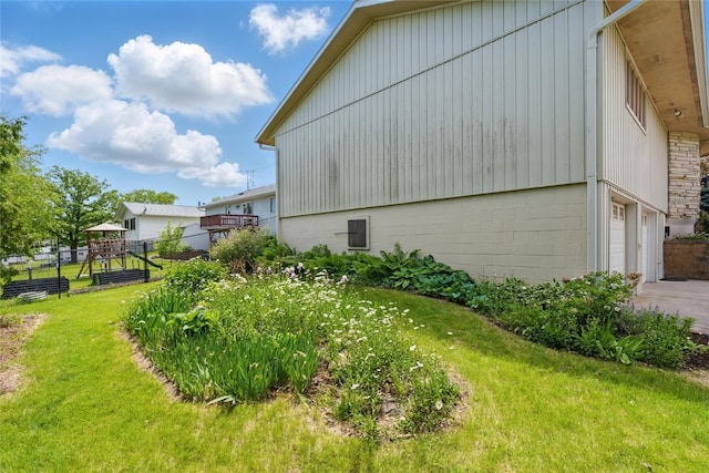 1004 W Welsh St, Williamsburg, IA 52361 - view of side of home featuring an attached garage