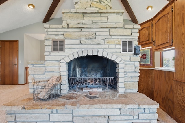 1004 W Welsh St, Williamsburg, IA 52361 - detailed view of beamed ceiling, carpet flooring, and a fireplace