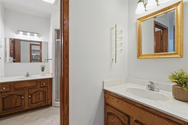 1004 W Welsh St, Williamsburg, IA 52361 - bathroom with vanity, a stall shower, and tile patterned floors