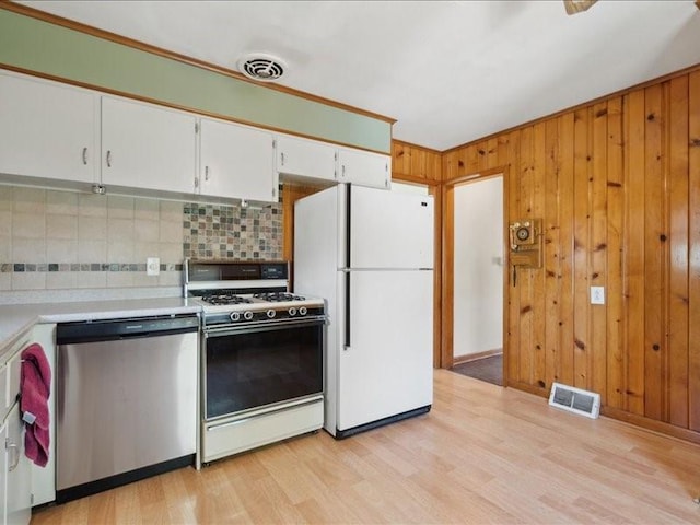 245 5th Ave, Marion, IA 52302 - kitchen featuring stainless steel dishwasher, gas range, freestanding refrigerator, tasteful backsplash, and light countertops