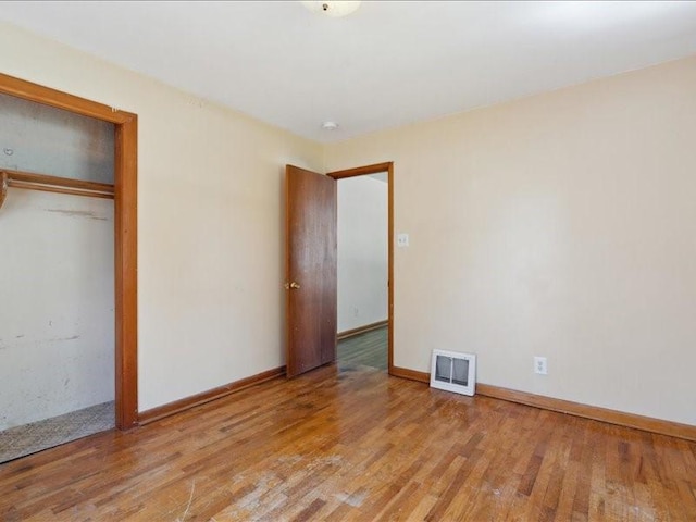 245 5th Ave, Marion, IA 52302 - unfurnished bedroom featuring light wood finished floors, baseboards, and a closet