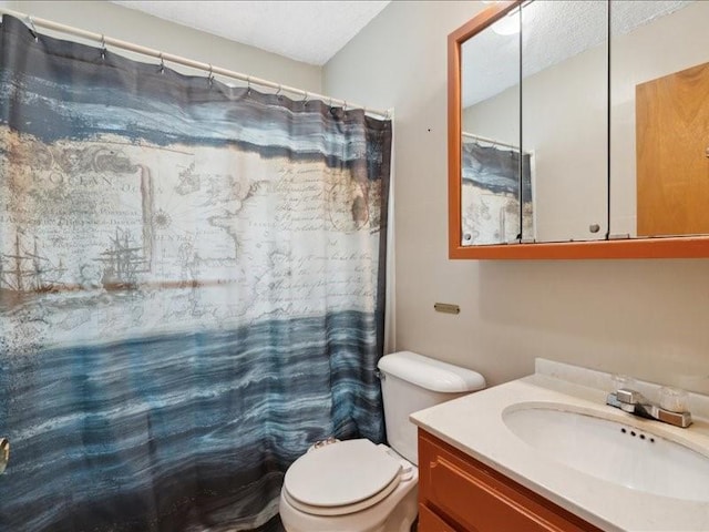 245 5th Ave, Marion, IA 52302 - bathroom with vanity, toilet, a textured ceiling, and a shower with curtain