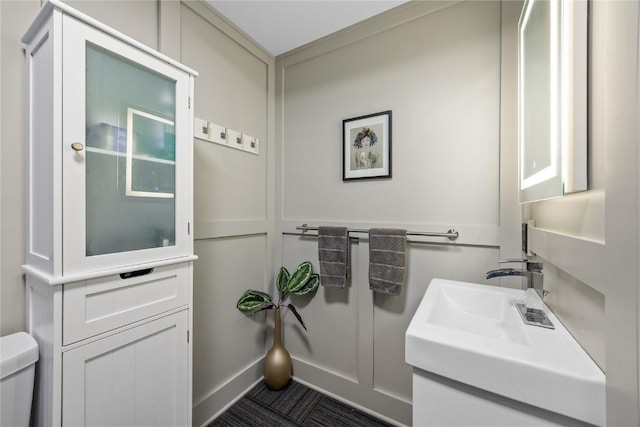 905 3rd St SE Unit 508, Cedar Rapids, IA 52401 - half bathroom featuring toilet and vanity