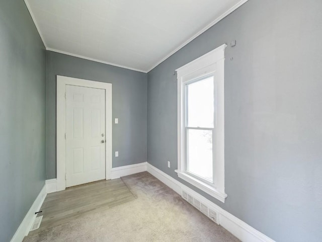 280 14th Ave SW, Cedar Rapids, IA 52404 - spare room featuring plenty of natural light, crown molding, baseboards, and carpet