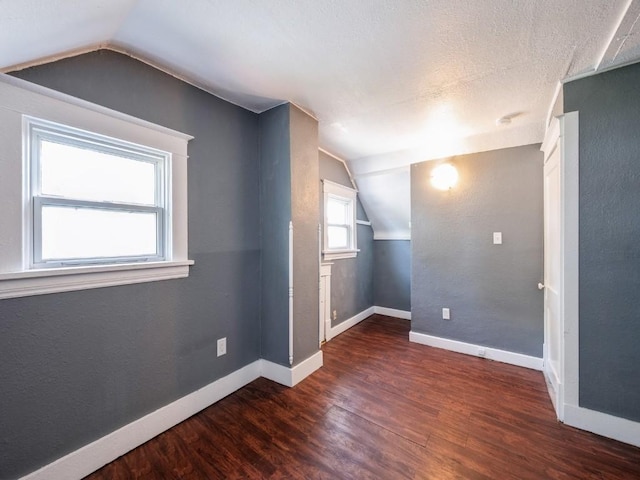 280 14th Ave SW, Cedar Rapids, IA 52404 - additional living space featuring lofted ceiling, wood finished floors, and baseboards