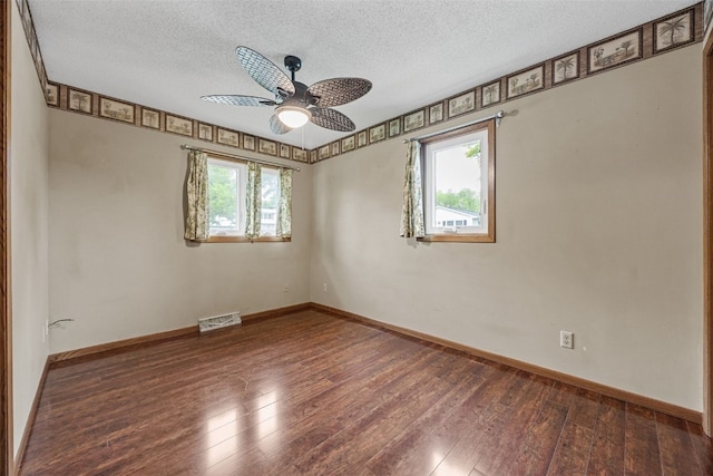 2536 N Ave NW, Cedar Rapids, IA 52405 - unfurnished room featuring a textured ceiling, a ceiling fan, wood-type flooring, and baseboards