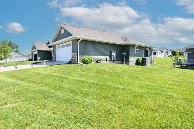 3902 Bluebird Dr SW, Cedar Rapids, IA 52404 - view of home's exterior with an attached garage, a yard, cooling unit, and driveway
