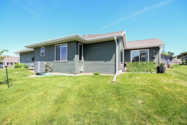 3902 Bluebird Dr SW, Cedar Rapids, IA 52404 - rear view of house featuring a yard and central air condition unit