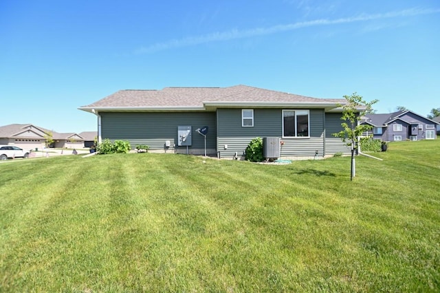 3902 Bluebird Dr SW, Cedar Rapids, IA 52404 - back of property with a yard and central air condition unit