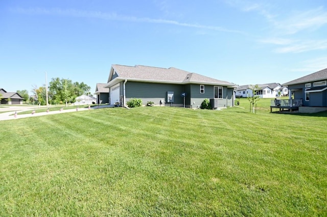 3902 Bluebird Dr SW, Cedar Rapids, IA 52404 - rear view of house with a garage and a lawn