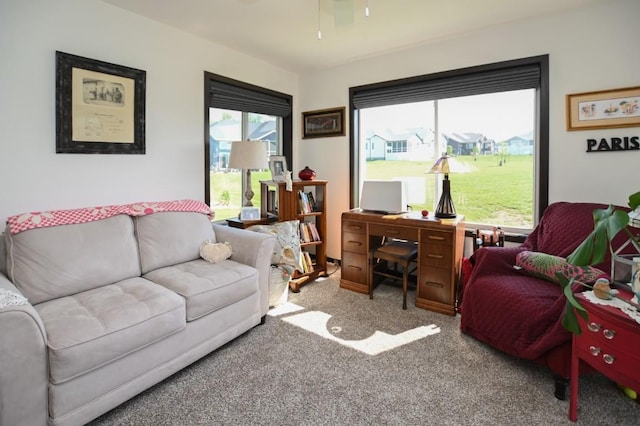 3902 Bluebird Dr SW, Cedar Rapids, IA 52404 - living area with carpet flooring, a desk, and ceiling fan