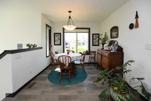 3902 Bluebird Dr SW, Cedar Rapids, IA 52404 - dining area featuring wood finished floors and baseboards