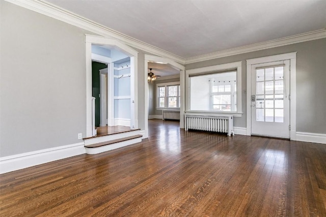 384 21st St SE, Cedar Rapids, IA 52403 - empty room with radiator heating unit, ceiling fan, ornamental molding, wood finished floors, and baseboards