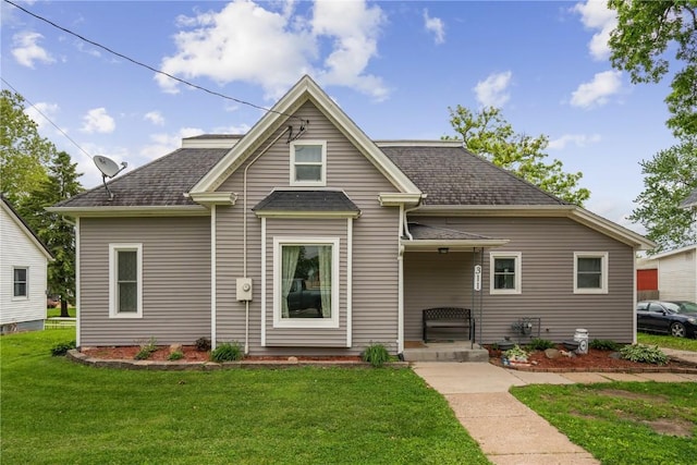 311 3rd St S, Coggon, IA 52218 - bungalow-style house with a front yard and a shingled roof