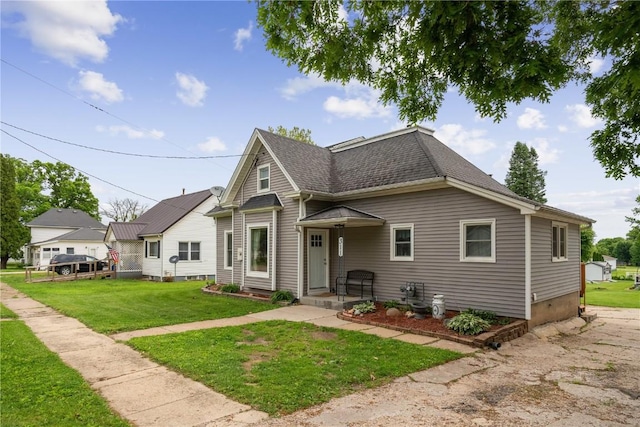 311 3rd St S, Coggon, IA 52218 - view of front facade with roof with shingles and a front yard