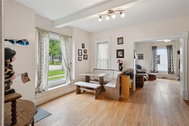 311 3rd St S, Coggon, IA 52218 - living area with light wood finished floors and beam ceiling
