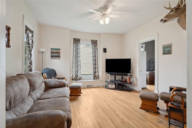 311 3rd St S, Coggon, IA 52218 - living area featuring a ceiling fan and wood finished floors