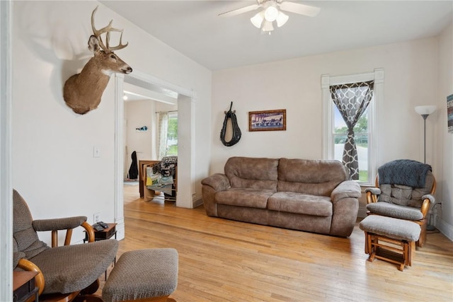 311 3rd St S, Coggon, IA 52218 - living area featuring a ceiling fan and light wood-style flooring