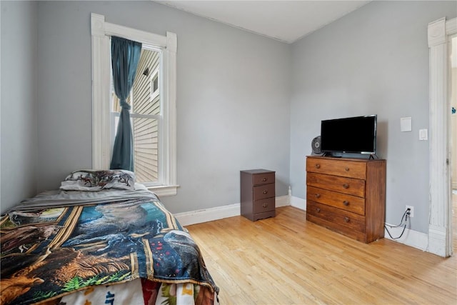 311 3rd St S, Coggon, IA 52218 - bedroom featuring wood finished floors and baseboards