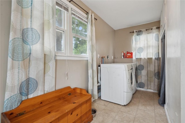 311 3rd St S, Coggon, IA 52218 - laundry room featuring washer / dryer and light tile patterned floors