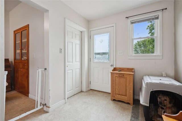 311 3rd St S, Coggon, IA 52218 - laundry room featuring cabinet space and baseboards