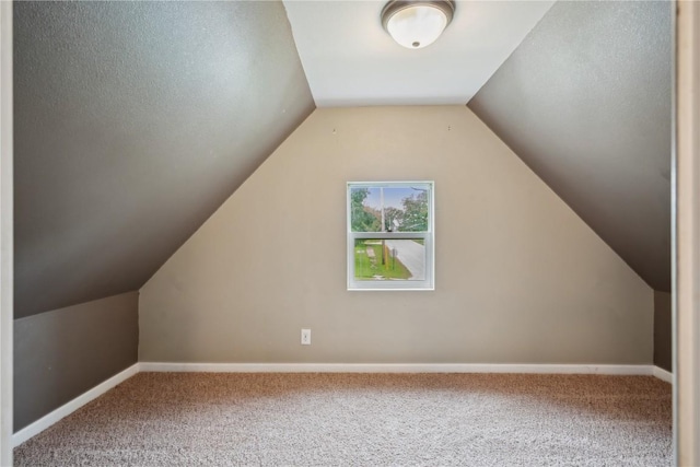 311 3rd St S, Coggon, IA 52218 - additional living space featuring carpet flooring, lofted ceiling, and baseboards
