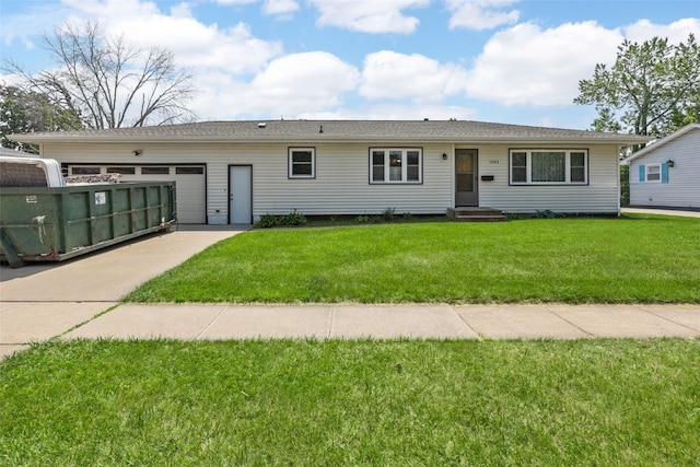 1083 Rainbow Blvd, Hiawatha, IA 52233 - ranch-style house with driveway, a garage, and a front yard
