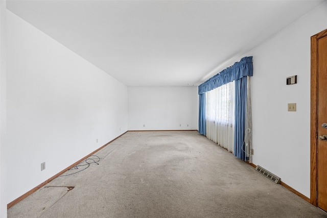 1083 Rainbow Blvd, Hiawatha, IA 52233 - carpeted spare room featuring baseboards