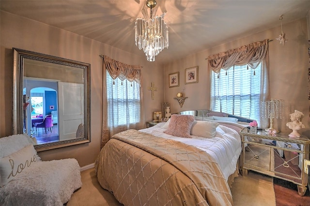 361 30th St SE, Cedar Rapids, IA 52403 - bedroom featuring multiple windows and a chandelier
