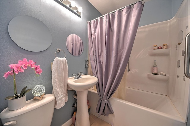 361 30th St SE, Cedar Rapids, IA 52403 - bathroom featuring toilet, shower / bath combination with curtain, and tile patterned flooring