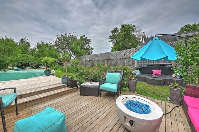 361 30th St SE, Cedar Rapids, IA 52403 - deck featuring a fenced backyard, a pool, and outdoor lounge area