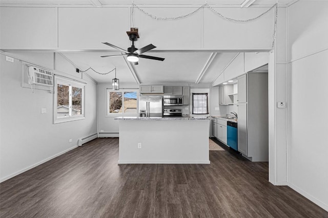 840 S Dubuque St, Solon, IA 52333 - kitchen with stainless steel appliances, plenty of natural light, gray cabinetry, and dark wood-style floors