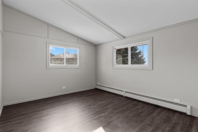 840 S Dubuque St, Solon, IA 52333 - spare room featuring a baseboard radiator, vaulted ceiling, wood finished floors, and baseboards
