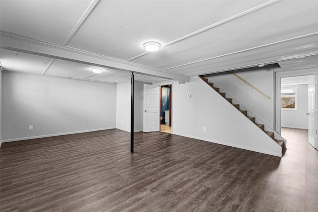 840 S Dubuque St, Solon, IA 52333 - below grade area with stairway, wood finished floors, and baseboards