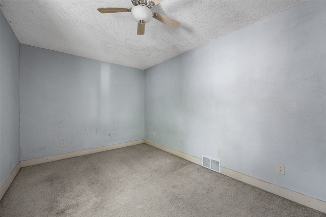 87 14th Ave SW, Cedar Rapids, IA 52404 - empty room with carpet floors, a ceiling fan, a textured ceiling, and baseboards