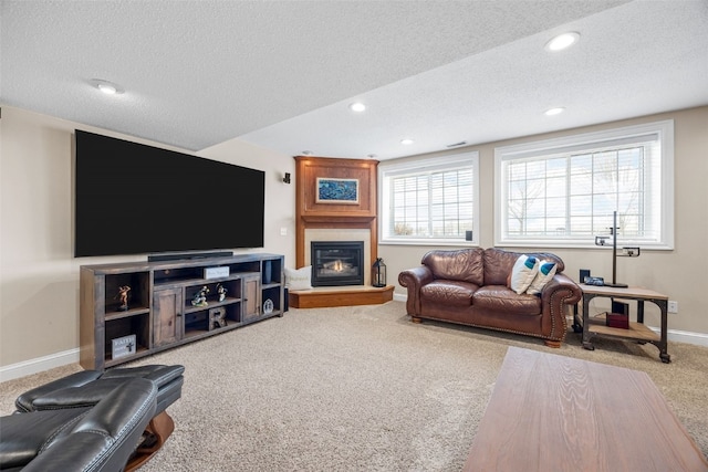2545 Silver Oak Trl, Marion, IA 52302 - carpeted living area with a textured ceiling, baseboards, a fireplace, and recessed lighting