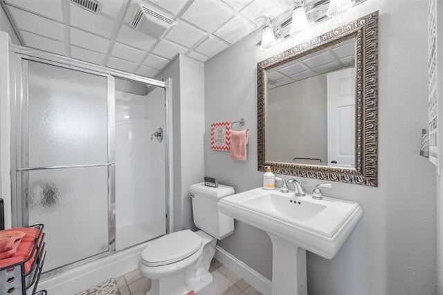 2545 Silver Oak Trl, Marion, IA 52302 - bathroom featuring toilet, a stall shower, tile patterned floors, and baseboards