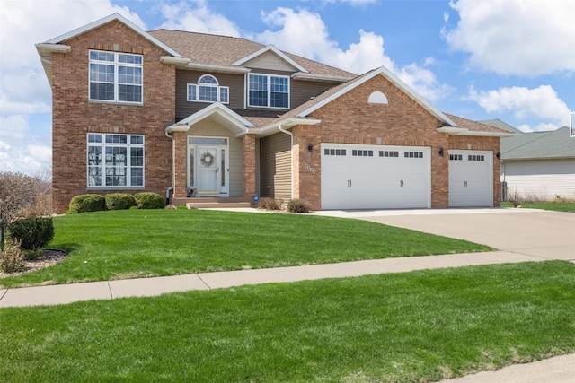 2545 Silver Oak Trl, Marion, IA 52302 - view of front facade with a garage, concrete driveway, brick siding, a front yard, and roof with shingles