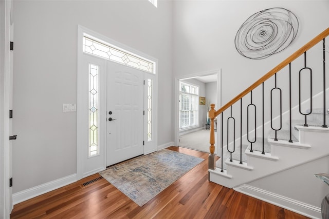 2545 Silver Oak Trl, Marion, IA 52302 - entrance foyer with wood finished floors, baseboards, stairs, and a high ceiling