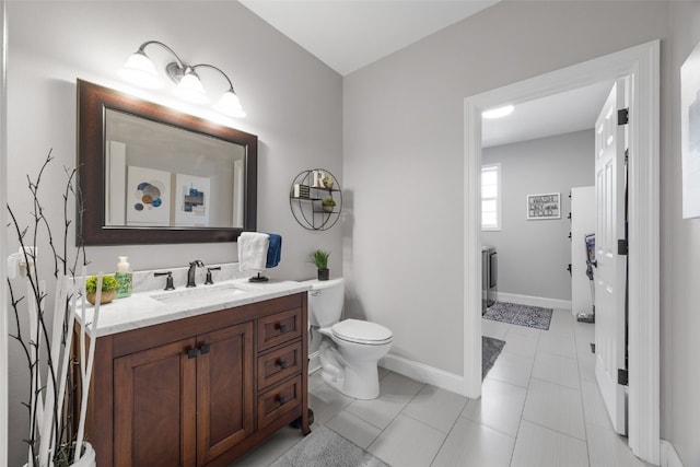 2545 Silver Oak Trl, Marion, IA 52302 - bathroom featuring vanity, toilet, baseboards, and tile patterned flooring