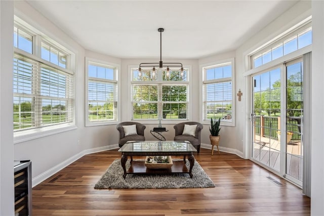 2545 Silver Oak Trl, Marion, IA 52302 - sunroom with plenty of natural light, baseboards, and wood finished floors