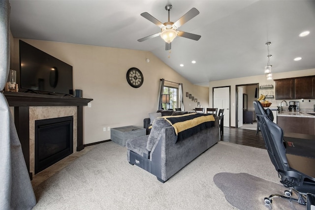 1330 Redbud Ave, Tiffin, IA 52340 - living area featuring a ceiling fan, vaulted ceiling, light carpet, a fireplace, and recessed lighting